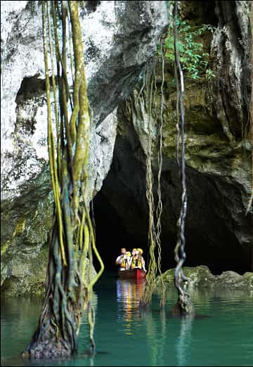 Guests canoeing through a cave.